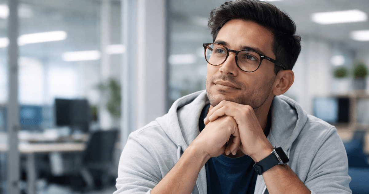 Young worker choosing between office job and skilled trade career while reviewing AI impact on future job stability