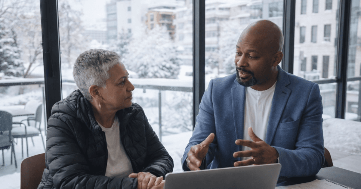 HR leaders developing workforce reduction strategy with executives reviewing headcount planning data and analytics in boardroom