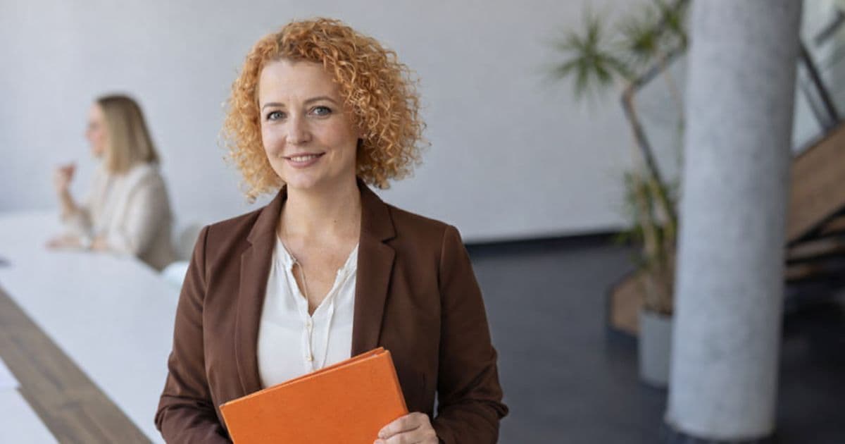 HR leaders reviewing layoff and outplacement strategy in modern office during rising US jobless claims