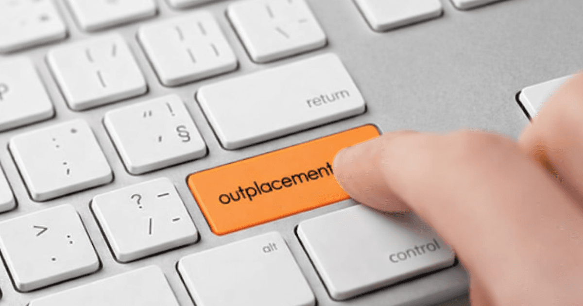 HR leader reviewing AI outplacement services as a low-cost option for supporting laid-off employees